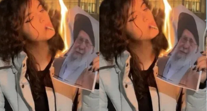 ഞങ്ങൾ-നിങ്ങളുടെ-കുഴിമാടത്തിൽ-നൃത്തം-ചെയ്യുമെന്ന്-ഞാൻ-പറഞ്ഞില്ലേ?-ഒരു-എലിയേ-പോലുള്ള-അവസാനം…-ആഹ്ലാദപ്രടകനവുമായി-ഖമനേയിയുടെ-ചിത്രം-കത്തിച്ച്-സിഗരറ്റ്-വലിച്ച-യുവതി