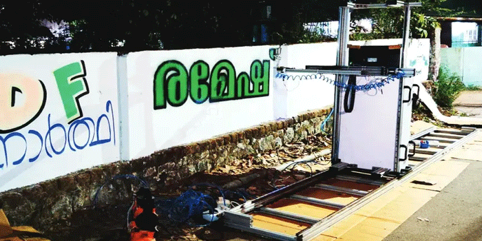 ചുവരെഴുതാൻ-ഇനി-ആളെ-തപ്പി-നടക്കേണ്ട;-ഏതു-നിറത്തിലും-ഭാഷയിലും-എഴുതി-തരാൻ-‘ചുവർബോട്ട്’-റോബോർട്ട്-റെഡി!